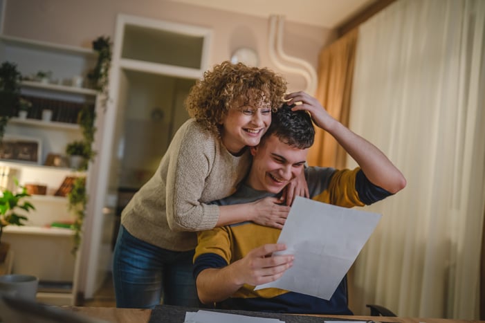 Mother and son celebrate an academic achievement.