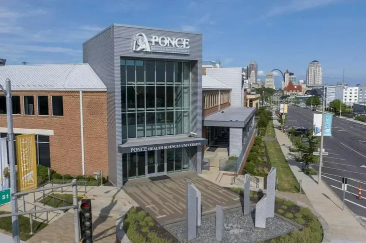 Front Ariel view of Ponce Health Sciences University School of Medicine building with stairs leading to the front door.