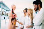medical students examining a body