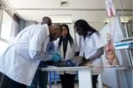 Medical students use a dummy arm to practice the method of injecting
