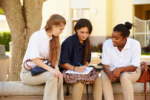 Group Of Female High School Students Working Outdoors