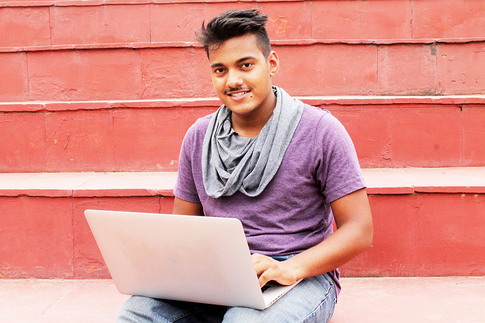 A pre-med student going through the medical school application process on a laptop.