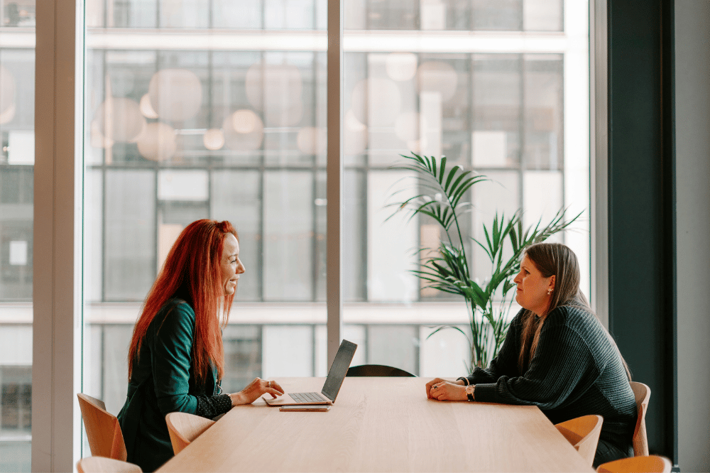 female caucasian AdCom interviewing a female caucasian prospective medical student about her interest in medical school