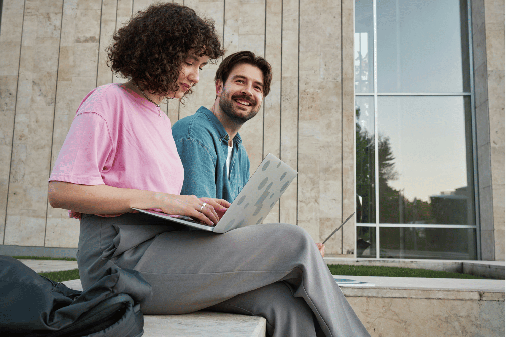 A female student doing last minute study for the MCAT with a male student encouraging her