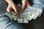 Person holding money fanned out