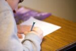 Student writing an essay