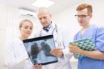 Med student and Doctor Looking at an X-ray