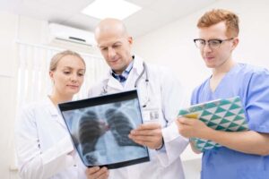 Med student and Doctor Looking at an X-ray