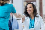 Medical Student helping another student