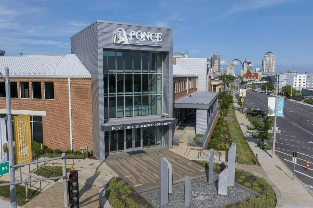 Front Ariel view of Ponce Health Sciences University School of Medicine building with stairs leading to the front door.