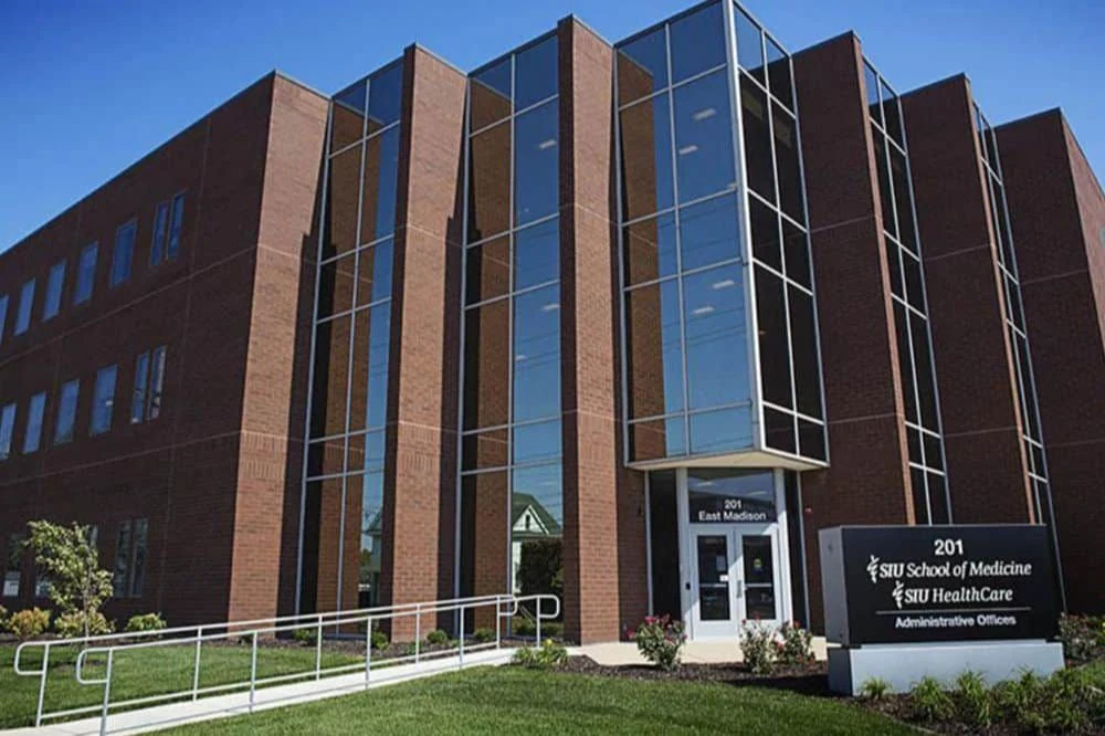 Front Street view of the Southern Illinois University School of Medicine building with a Fram leading to the front entrance.
