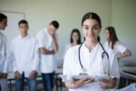 Medical Student Preparing for residency program with a white coat.
