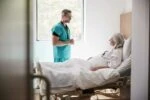 Doctor checking in on a patient in the hospital