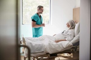 Doctor checking in on a patient in the hospital